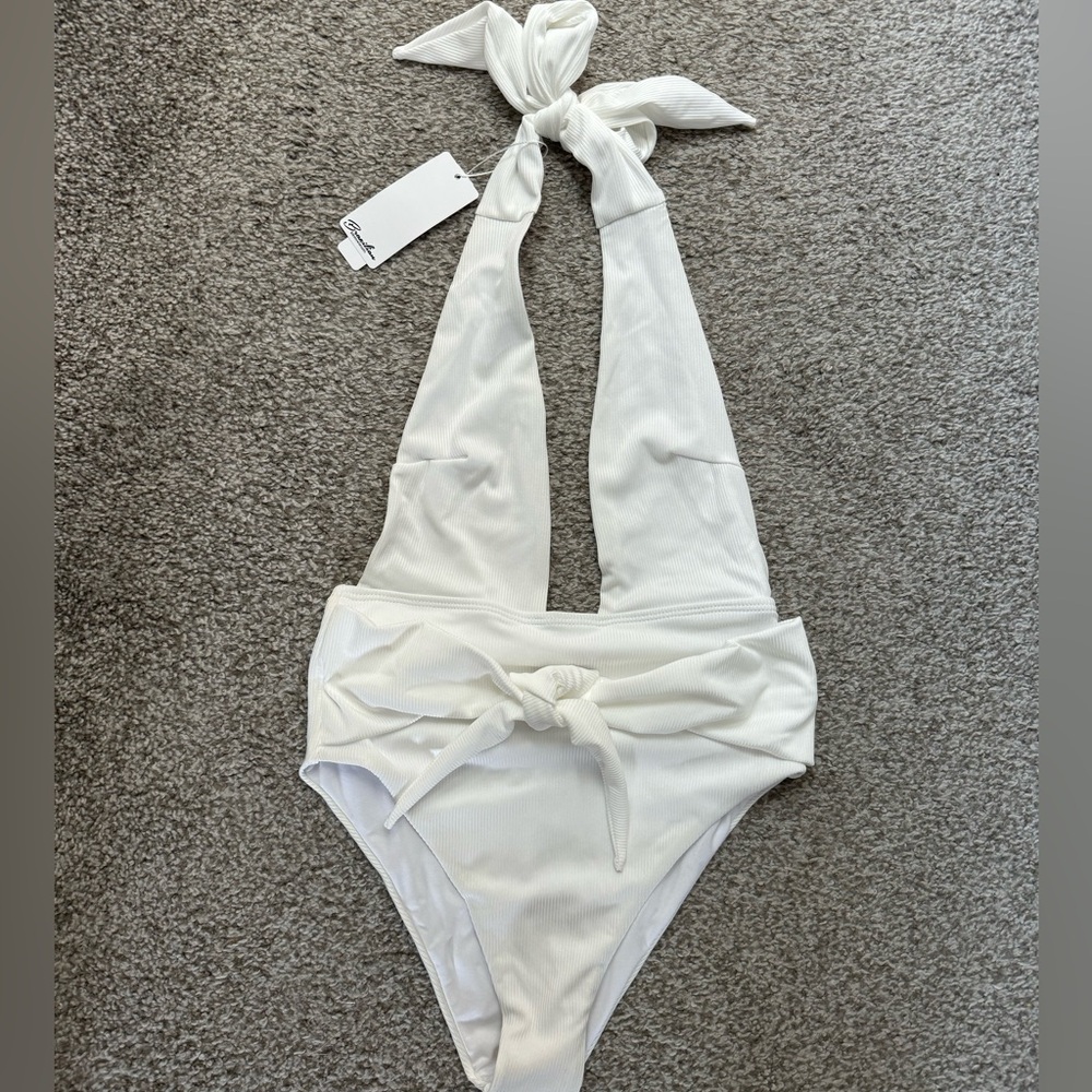 Bought bathing suit for my honeymoon. Too small. Never worn. Tags attached